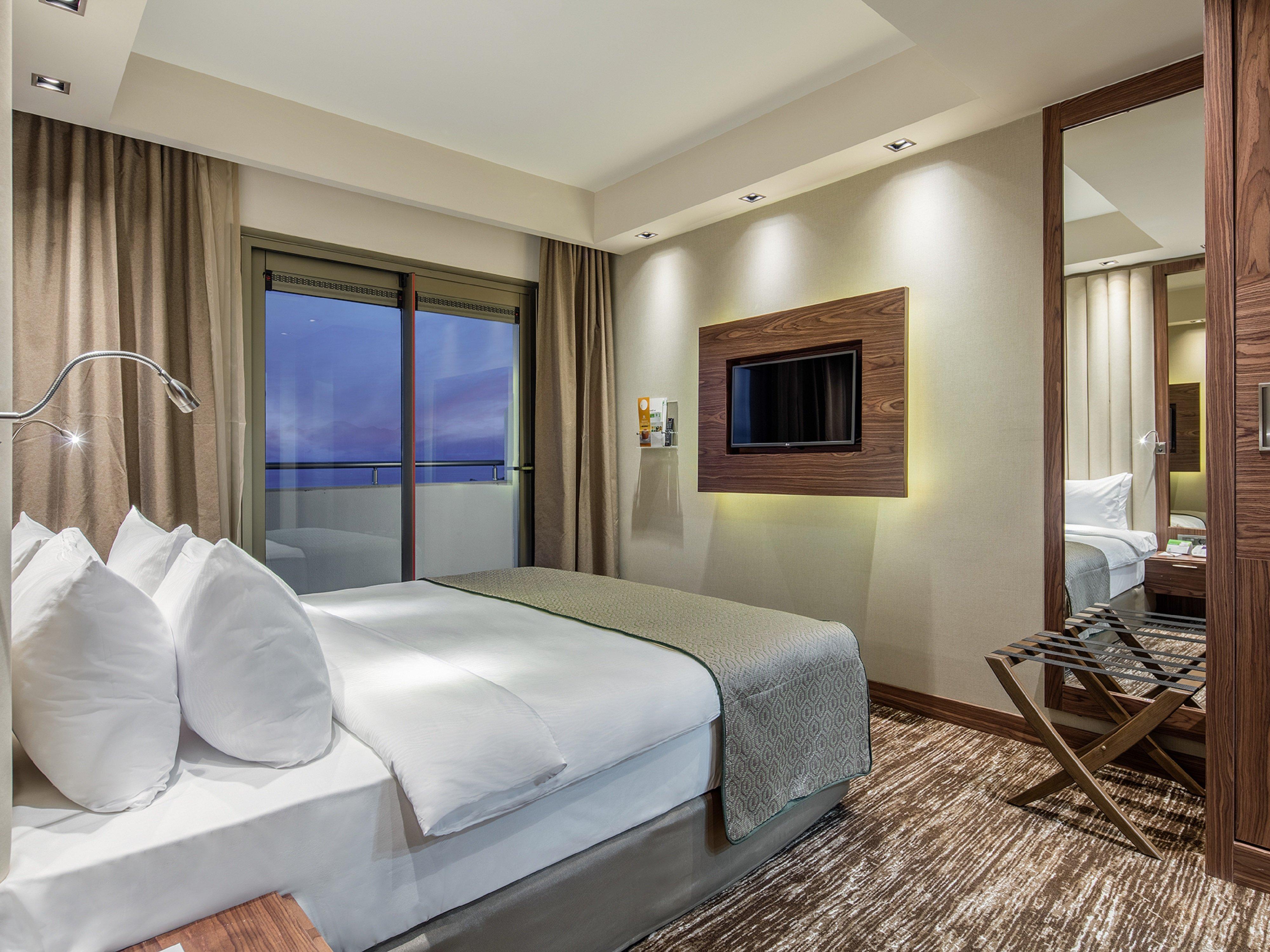 فندق هوليداي إن أنطاليا - لارا المظهر الخارجي الصورة A bedroom at the hotel